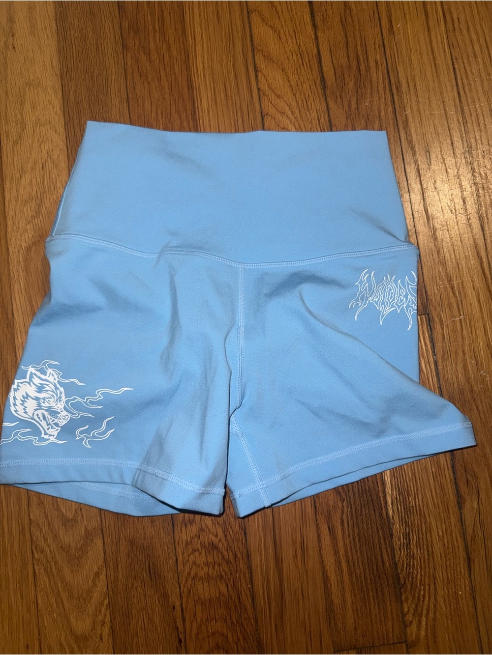 Darc Sport Light Blue High-Waist Women’s Active Shorts with White Flame Accent